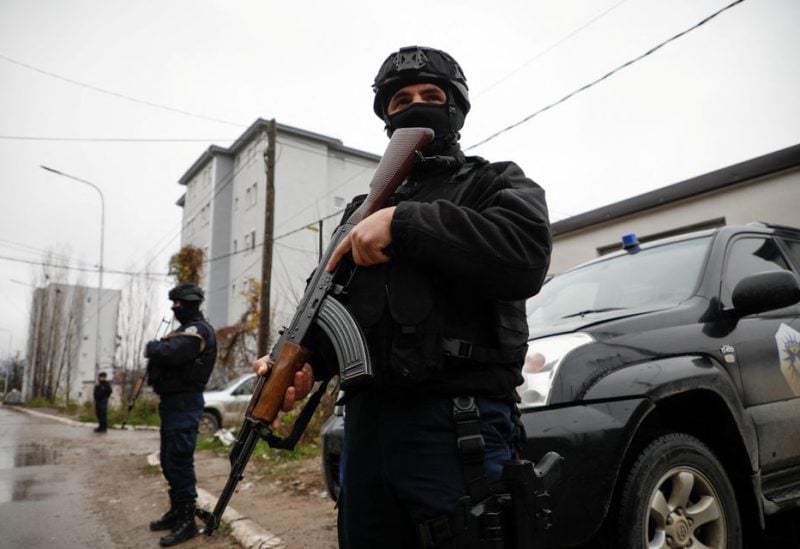 Kosovo police officers patrol an area in the northern part of the ethnically-divided town of Mitrovica, Kosovo, December 12, 2022. REUTERS