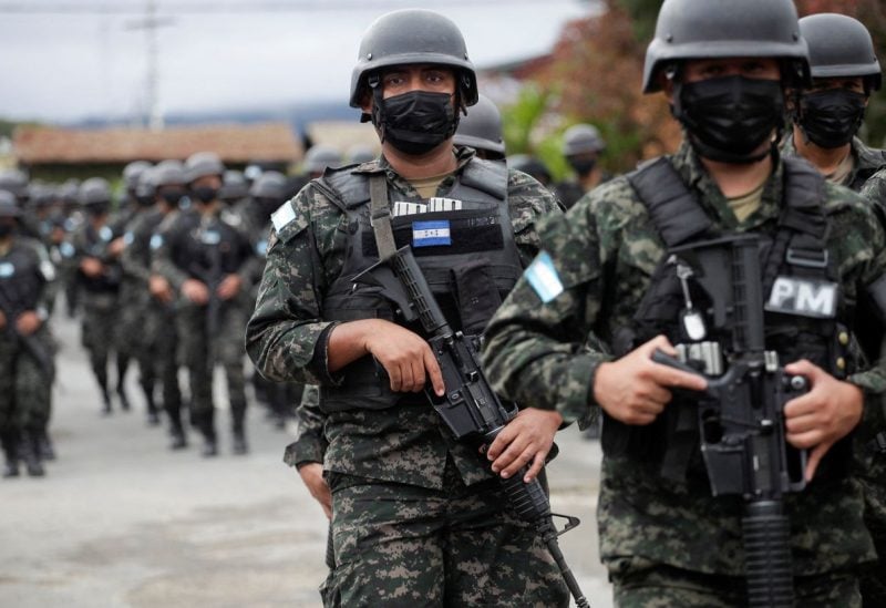 Members of Honduras' military police prepare to be deployed at the border, after President Xiomara Castro declared a national security emergency, implementing a new plan to combat a rising number of cases of extortion by violent criminal groups operating across the country, in Tegucigalpa, Honduras November 27, 2022. REUTERS/Fredy Rodriguez