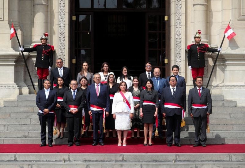 Peru's President Dina Boluarte, who took office after her predecessor Pedro Castillo was ousted, poses along with her new Cabinet in Lima, Peru December 10, 2022. REUTERS/Sebastian Castaneda