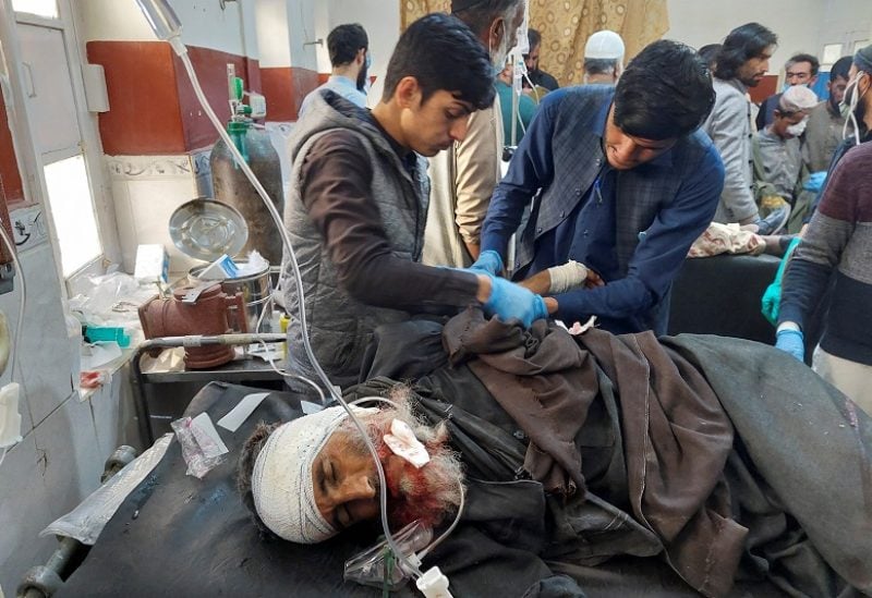 SENSITIVE MATERIAL. THIS IMAGE MAY OFFEND OR DISTURB A man injured during cross-border shelling and gunfire, receives first aid at a hospital in the Pakistan-Afghanistan border town of Chaman, Pakistan December 15, 2022. REUTERS/Abdul Khaliq Achakzai