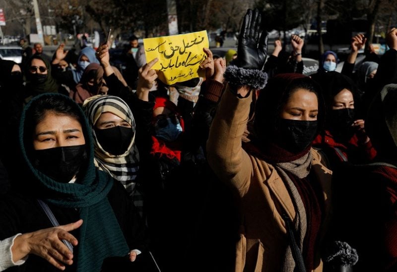 Afghan women chant slogans in protest against the closure of universities to women by the Taliban in Kabul, Afghanistan, December 22, 2022. REUTERS/Stringer