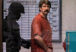 FILE PHOTO: Alleged arms smuggler Viktor Bout from Russia is escorted by a member of the special police unit as he arrives at a criminal court in Bangkok October 4, 2010. REUTERS/Damir Sagolj//File Photo