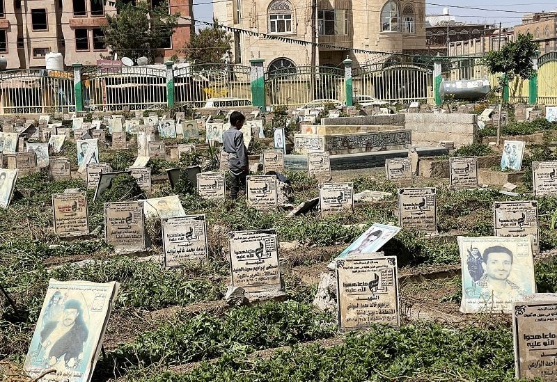 FILE PHOTO: A boy stands at a cemetery dedicated for Houthi fighters in Sanaa, Yemen October 3, 2022. REUTERS/Khaled Abdullah/File Photo