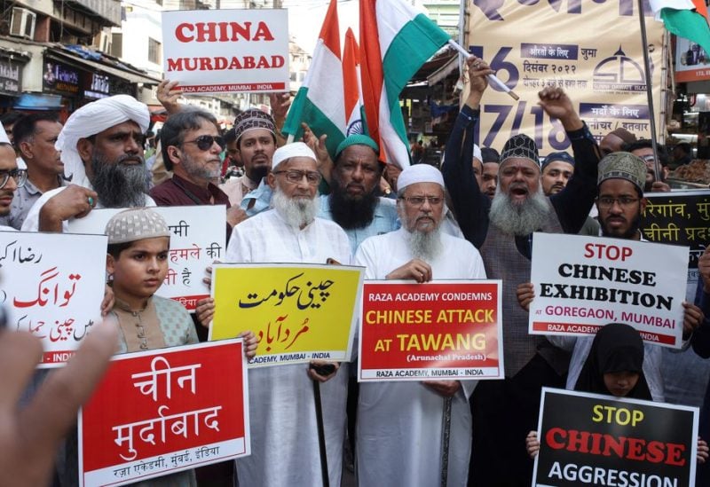 Demonstrators hold signs during a protest against China, following a border scuffle at the Tawang sector of India's northeastern Himalayan state of Arunachal Pradesh that led to injuries to soldiers on both sides, in Mumbai, India, December 13, 2022 - REUTERS