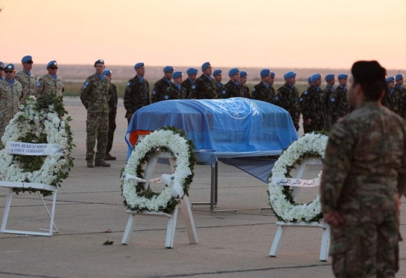 Wreath of flowers are placed near the coffin of Irish soldier Sean Rooney who was killed on a U.N. peacekeeping Patrol, during repatriation ceremony at Beirut international airport, in Beirut, Lebanon December 18, 2022. REUTERS