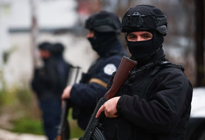 Kosovo police officers patrol an area in the northern part of the ethnically-divided town of Mitrovica, Kosovo, December 12, 2022. REUTERS/Florion Goga