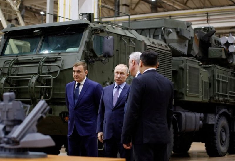 Russian President Vladimir Putin, accompanied by Tula Region Governor Alexei Dyumin, visits the Shcheglovsky Val machine building plant, a subsidiary of KBP Instrument Design Bureau, in Tula, Russia December 23, 2022 - REUTERS