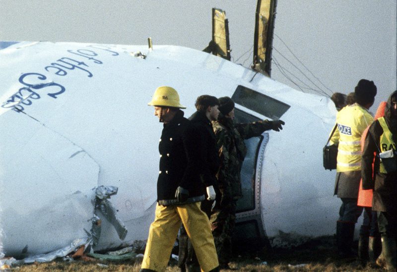 FILE PHOTO: A December 23, 1988 file photo shows Scottish rescue workers and crash investigators search the area around the cockpit of Pan Am flight 103 in a farmer's field east of Lockerbie, Scotland.REUTERS/Greg Bos KM/CLH/
