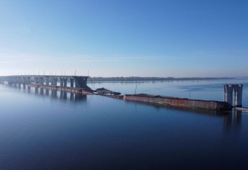 A view shows the destroyed Antonivskyi bridge over the Dnipro river after Russia's retreat from Kherson, in Kherson, Ukraine November 15, 2022. REUTERS