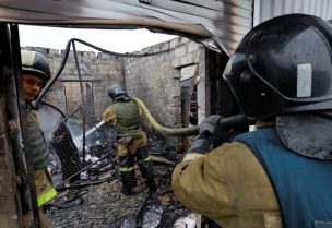 Firefighters work at a local market hit by shelling in the course of Russia-Ukraine conflict in Donetsk, Russian-controlled Ukraine, December 12, 2022. REUTERS