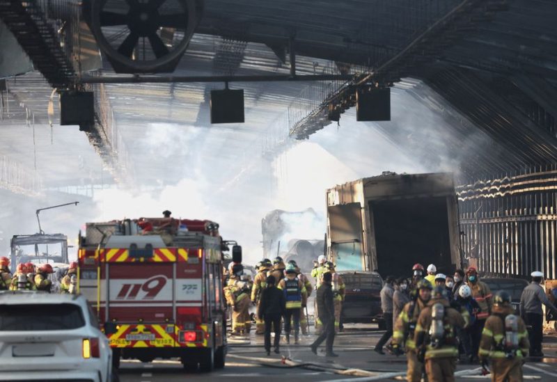 Burnt trucks are seen inside a tunnel that was burnt down in Gwacheon, South Korea, December 29, 2022 - REUTERS