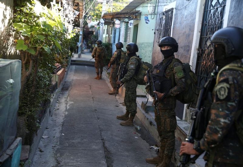 Troops stand in an alley in the suburb of Soyapango, after El Salvador's President Nayib Bukele announced the deployment of 10,000 security forces to the troubled area which for years has been considered a stronghold of the violent Mara Salvatrucha and Barrio 18 gangs, in San Salvador, El Salvador December 3, 2022 -REUTERS