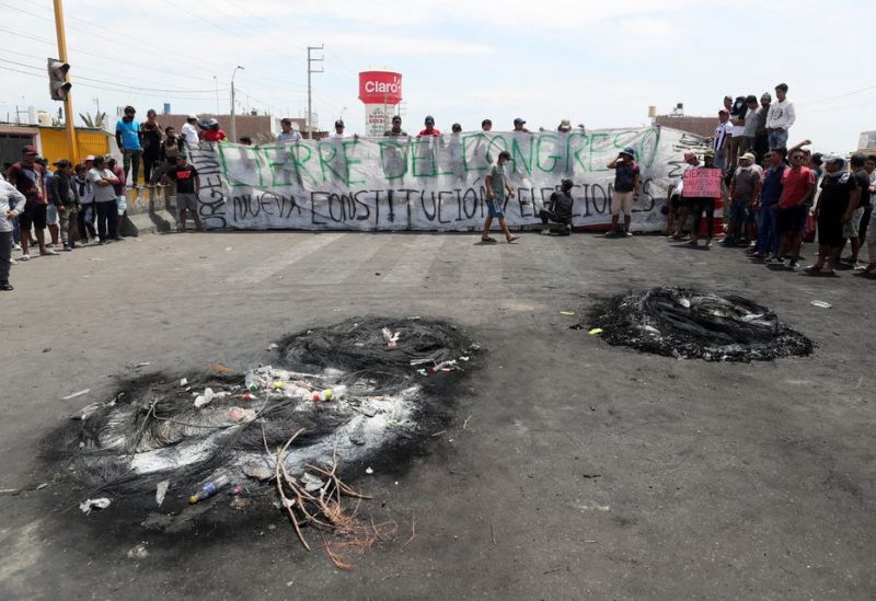Demonstrators block a highway to Lima while demanding early elections and the release of Peruvian ousted leader Pedro Castillo, in Ica, Peru December 13, 2022. REUTERS