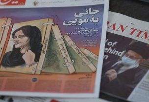 A newspaper with a cover picture of Mahsa Amini, a woman who died after being arrested by the Islamic republic's "morality police" is seen in Tehran, Iran September 18, 2022 - REUTERS