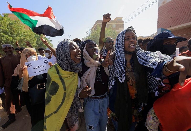 Protesters march during a rally against a signed framework deal between political parties and the military that provides for a two-year civilian-led transition towards elections and would end a standoff triggered by a coup in October 2021, in Khartoum, Sudan December 8, 2022. REUTERS/Mohamed Nureldin Abdallah
