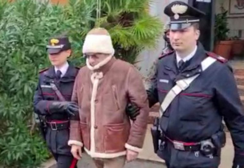 A screengrab taken from a video shows Matteo Messina Denaro the country's most wanted mafia boss being escorted out of a Carabinieri police station after he was arrested in Palermo, Italy, January 16, 2023. Carabinieri/Handout via REUTERS