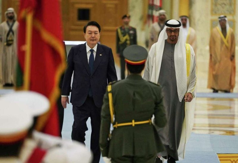 South Korean President Yoon Suk Yeol, center left, and Emirati leader Sheikh Mohammed bin Zayed Al Nahyan walk past an honor guard at Qasar Al Watan in Abu Dhabi, United Arab Emirates, Sunday, Jan. 15, 2023. Yoon received an honor guard welcome Sunday on a trip to the United Arab Emirates, where Seoul hopes to expand its military sales while finishing its construction of the Arabian Peninsula's first nuclear power plant.Jon Gambrell/AP