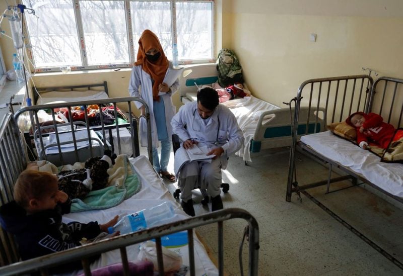 A doctor visits patients in a hospital following an increase in the number of pneumonia cases in Kabul, Afghanistan, December 17, 2022. REUTERS/Ali Khara