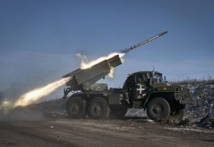 Ukrainian army Grad multiple rocket launcher fires rockets at Russian positions in the frontline near Soledar, Donetsk region, Ukraine, Wednesday, Jan. 11, 2023. (AP Photo/Libkos)
