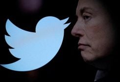 Twitter logo and a photo of Elon Musk are displayed through magnifier in this illustration taken October 27, 2022. REUTERS/Dado Ruvic/Illustration/File Photo/File Photo