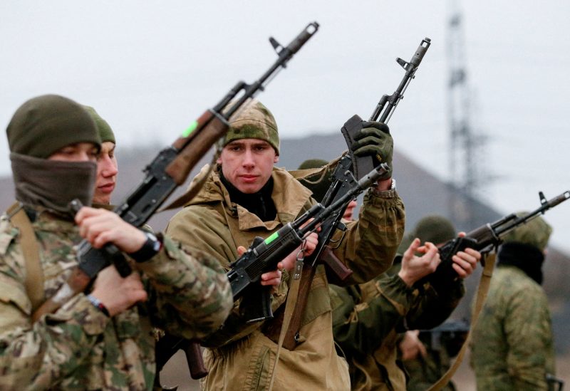 Militants of the self-proclaimed Donetsk People's Republic take part in shooting drills at a range on the outskirts of Donetsk, Ukraine, December 14, 2021. REUTERS/Alexander Ermochenko/File Photo