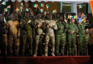 Members of the forty-six Ivorian soldiers recently pardoned by Mali's junta, celebrate during their arrival at the international Felix Houphouet Boigny airport in Abidjan, Ivory Coast January 8, 2023. REUTERS/Luc Gnago