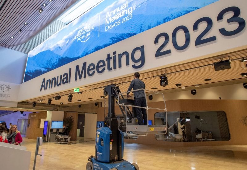 A worker stands on a mobile lift in a hall at Davos Congress Centre, the venue of the World Economic Forum (WEF) 2023, in the Alpine resort of Davos, Switzerland, January 15, 2023. REUTERS