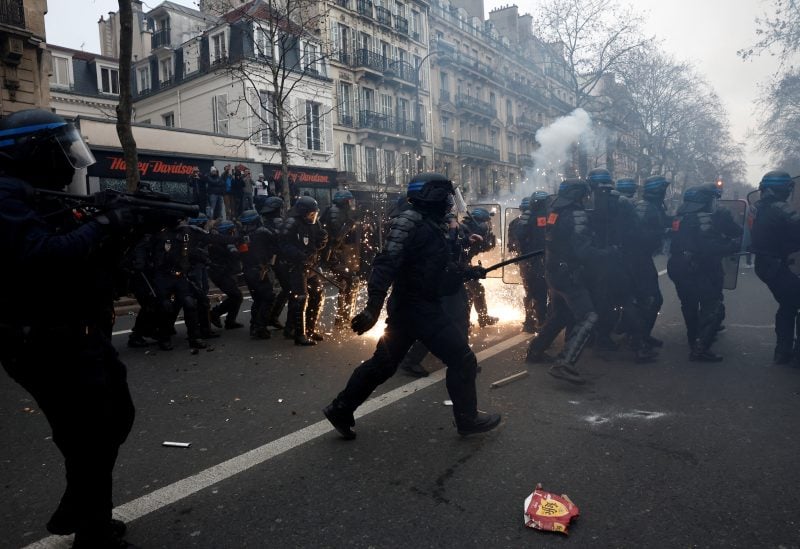 French CRS riot police stand on position amid clashes during a demonstration against French government's pension reform plan in Paris as part of a day of national strike and protests in France, January 19, 2023. REUTERS/Benoit Tessier