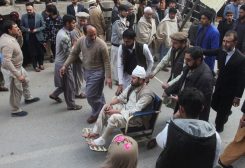 Men move an injured victim, after a suicide blast in a mosque, at hospital premises in Peshawar, Pakistan January 30, 2023. REUTERS/Khuram Parvez