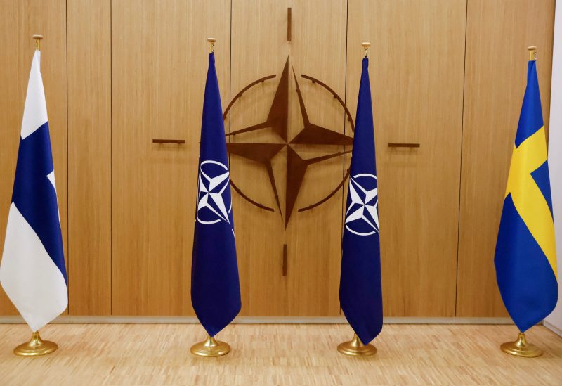 A view of the flags of Finland, NATO and Sweden during a ceremony to mark Sweden's and Finland's application for membership in Brussels, Belgium, May 18, 2022. REUTERS/Johanna Geron/Pool/File Photo