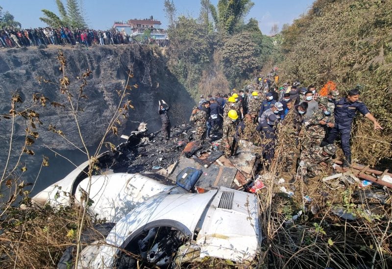 Rescue teams work to retrieve bodies at the crash site of an aircraft carrying 72 people in Pokhara in western Nepal January 15, 2023. Bijay Neupane/Handout via REUTERS THIS IMAGE HAS BEEN SUPPLIED BY A THIRD PARTY. MANDATORY CREDIT. NO RESALES. NO ARCHIVES.