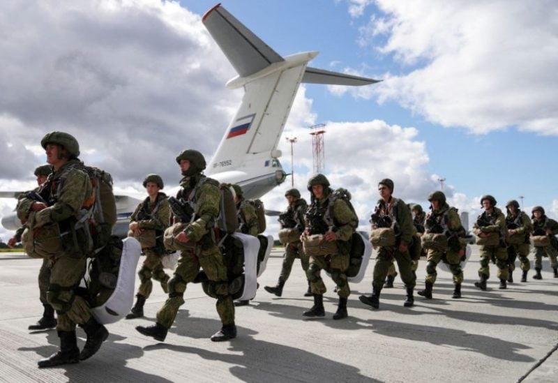 Russian paratroopers walk before boarding Ilyushin Il-76 transport planes as they take part in the military exercises "Zapad-2021" staged by the armed forces of Russia and Belarus at an aerodrome in Kaliningrad Region, Russia, September 13, 2021. REUTERS/Vitaly Nevar/File Photo