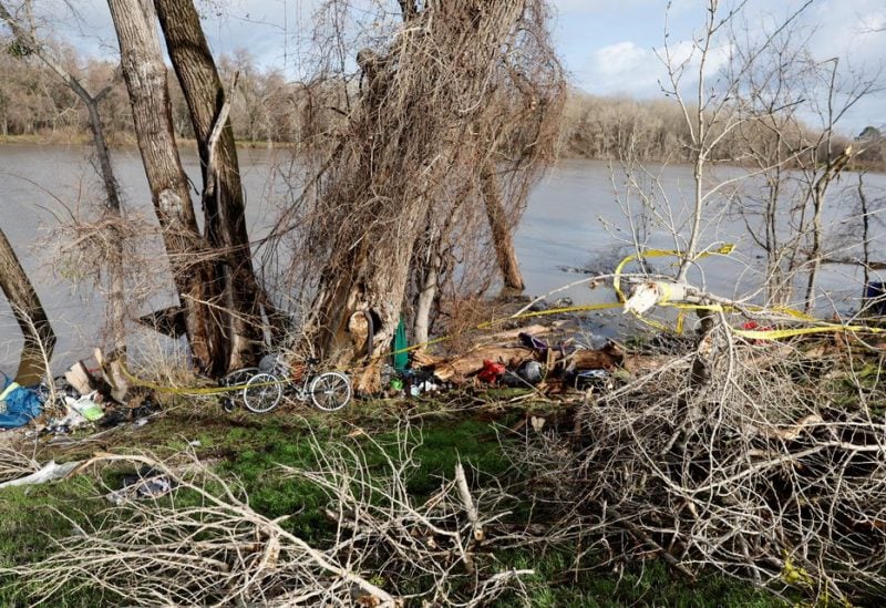 A view of a scene where a homeless woman was killed by a falling tree branch during a winter storm, at the bank of the Sacramento River in Sacramento, California, U.S. January 8, 2023 - REUTERS