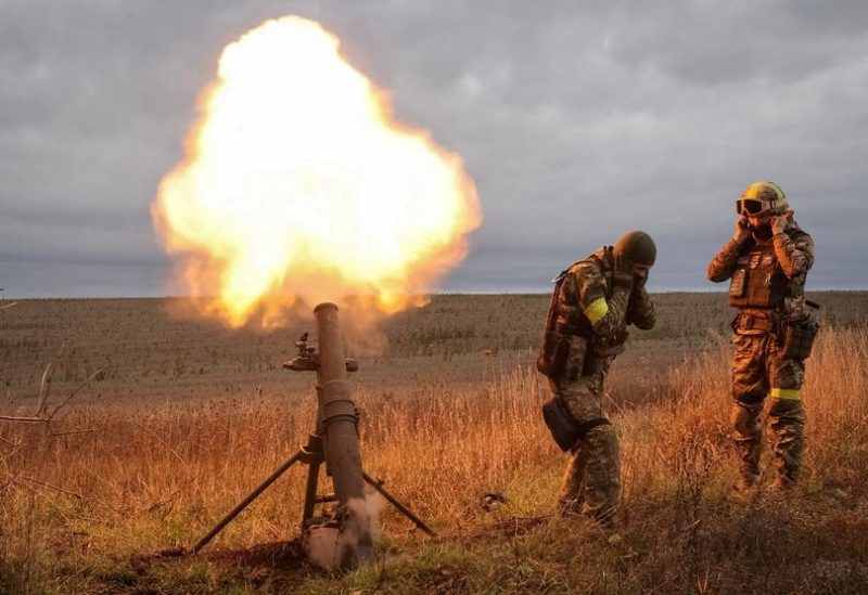 Ukrainian servicemen fire a mortar on a frontline, as Russia's attack on Ukraine continues, in Kharkiv region, Ukraine October 25, 2022. REUTERS/Vyacheslav Madiyevskyy