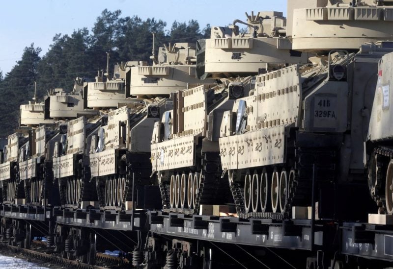 U.S. Bradley fighting vehicles that will be deployed in Latvia for NATO's Operation Atlantic Resolve wait for an unload in Garkalne, Latvia February 8, 2017. REUTERS/Ints Kalnins/File Photo