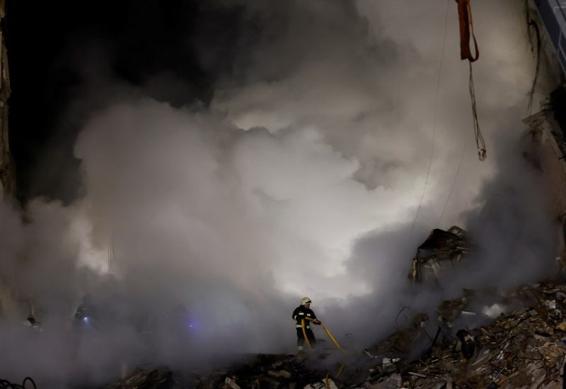 Emergency personnel work at the site where an apartment block was heavily damaged by a Russian missile strike, amid Russia's attack on Ukraine, in Dnipro, Ukraine January 15, 2023. REUTERS/Clodagh Kilcoyne