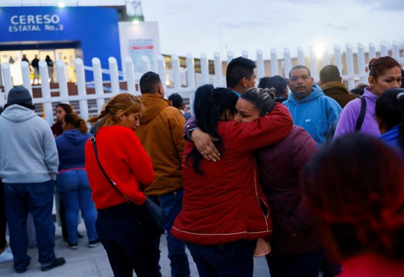 Relatives of inmates react outside the Cereso number 3 state prison after unknown assailants entered the prison and freed several inmates, resulting in injuries and deaths, according to local media, in Ciudad Juarez, Mexico January 1, 2023. REUTERS/Jose Luis Gonzalez