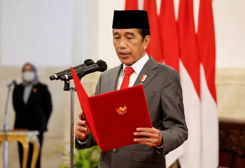 Indonesian President Joko Widodo reads out vows taken by newly appointed ministers and deputy ministers during an inauguration at a Presidential Palace in Jakarta, Indonesia, June 15, 2022. REUTERS