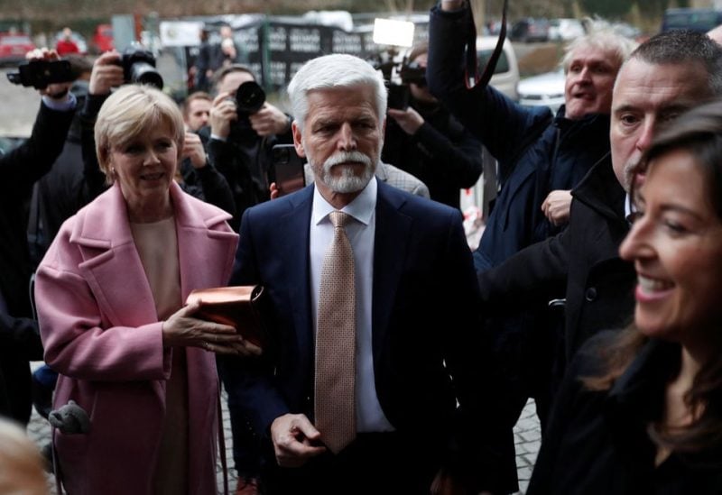 Czech presidential candidate Petr Pavel and his wife Eva Pavlova arrive at his headquarters, during the country's presidential election, in Prague, Czech Republic January 28, 2023. REUTERS