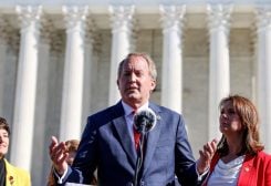 Texas Attorney General Ken Paxton speaks to anti-abortion supporters outside the U.S. Supreme Court following arguments over a challenge to a Texas law that bans abortion after six weeks in Washington, U.S., November 1, 2021 - REUTERS