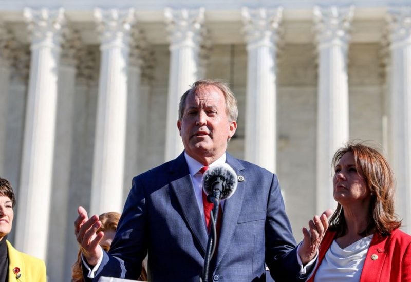 Texas Attorney General Ken Paxton speaks to anti-abortion supporters outside the U.S. Supreme Court following arguments over a challenge to a Texas law that bans abortion after six weeks in Washington, U.S., November 1, 2021 - REUTERS