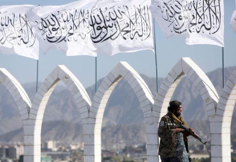 A Taliban fighter is seen at the Taliban flag-raising ceremony in Kabul, Afghanistan, March 31, 2022.REUTERS