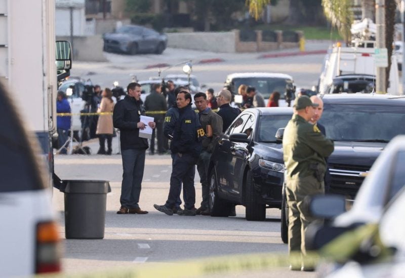 FBI agents gather in front of the location of a shooting during Chinese Lunar New Year celebrations in Monterey Park, California, U.S. January 22, 2023. REUTERS