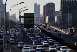 Cars move on a street at the Beijing's Central Business District (CBD), during the morning rush hour following the Chinese Lunar New Year holiday, in Beijing, China, January 30, 2023. REUTERS/Tingshu Wang
