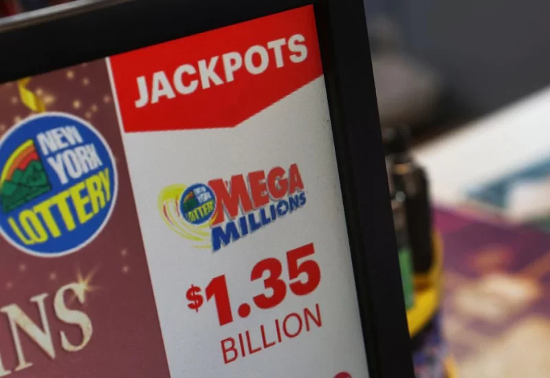 A digital screen advertisement for the “Mega Millions" lottery prize at over $1.35 billion ahead of the January 13th multi-state prize drawing is seen at a ticket sales shop in Great Neck, New York, U.S., January 13, 2023. REUTERS