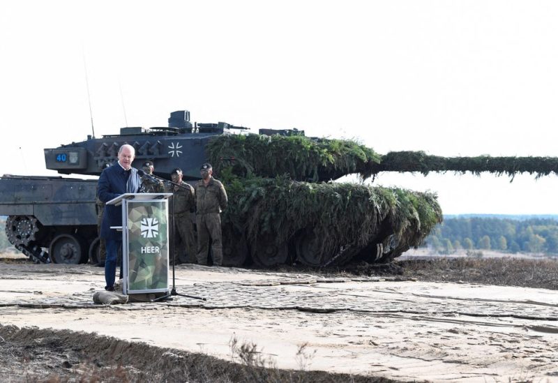 German Chancellor Olaf Scholz delivers a speech in front of a Leopard 2 tank during a visit to a military base of the German army Bundeswehr in Bergen, Germany, October 17, 2022. REUTERS