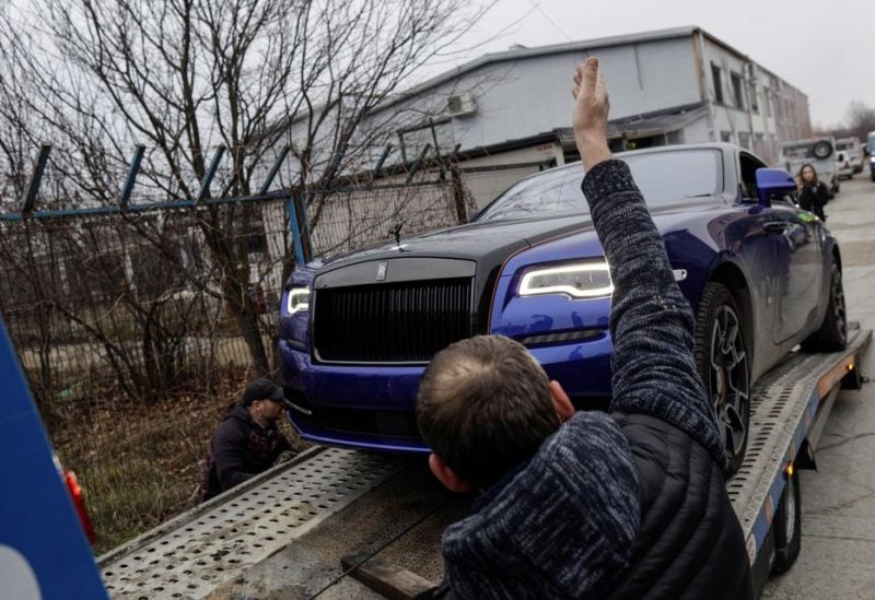 Romanian prosecutors take away luxury cars seized in Andrew Tate case