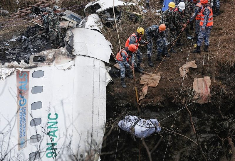A rescue team recovers the body of a victim from the site of the plane crash of a Yeti Airlines operated aircraft, in Pokhara, Nepal January 16, 2023. REUTERS/Rohit Giri NO RESALES. NO ARCHIVES