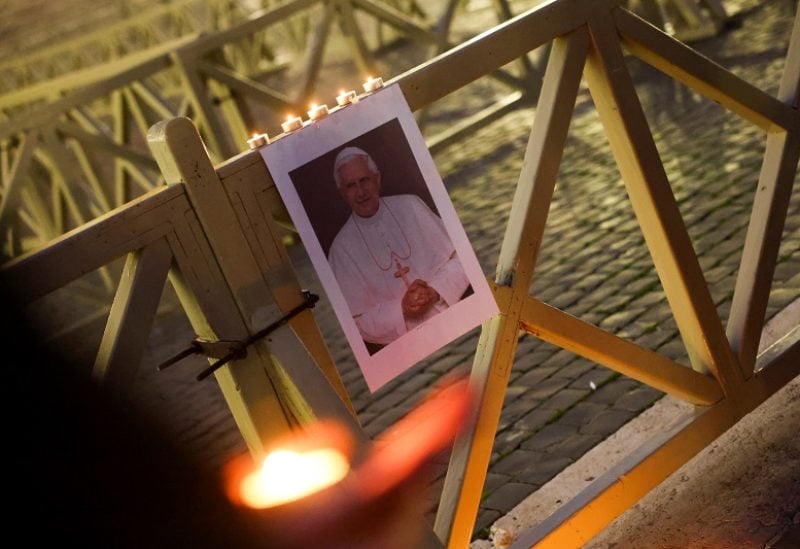 A view shows an image of former Pope Benedict in front of St Peter's Basilica as the Roman Catholic Church marks its World Day of Peace, at St. Peter's Square at the Vatican, January 1, 2023. REUTERS/Kai Pfaffenbach