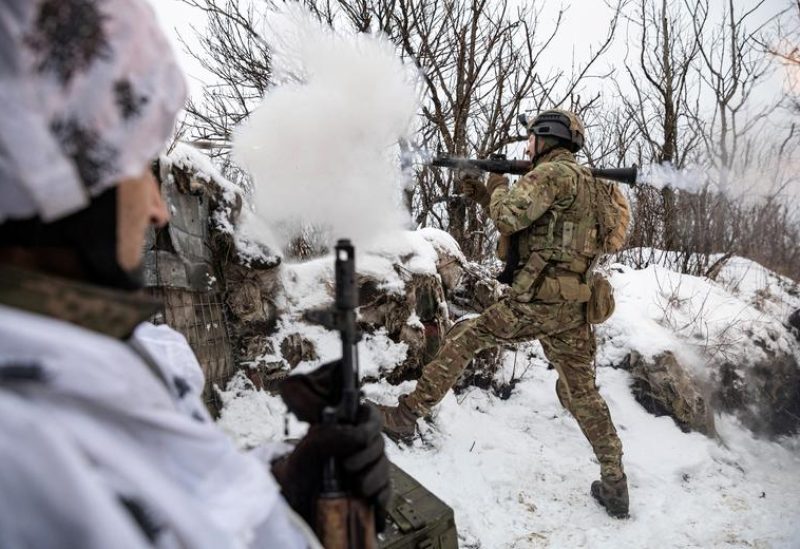 Bohdan, "Fritz", the deputy of commander of the unit in 79th Air Assault Brigade, fires a rocket-propelled grenade (RPG) towards Russian positions on a frontline near the town of Marinka, amid Russia's attack on Ukraine, Donetsk region, Ukraine, February 14, 2023. REUTERS/Marko Djurica